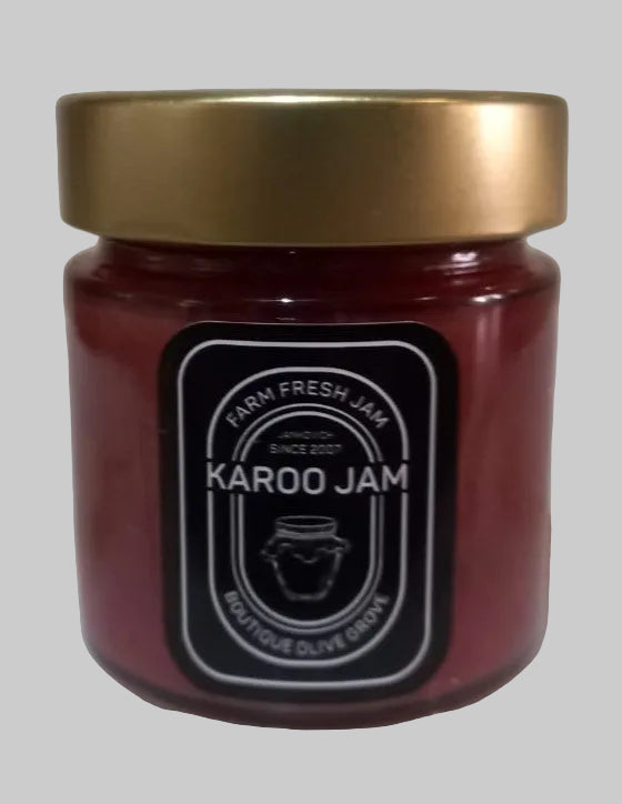 Jar of Karoo Jam with a gold lid on a white surface